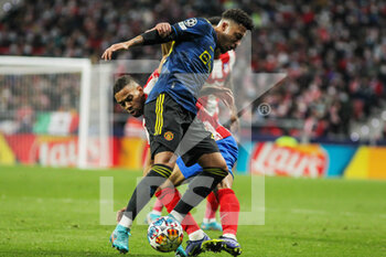 2022-02-23 - Jadon Sancho of Manchester United and Renan Lodi of Atletico de Madrid during the UEFA Champions League, round of 16, 1st leg football match between Atletico de Madrid and Manchester United on February 23, 2022 in Madrid, Spain - ATLETICO DE MADRID VS MANCHESTER UNITED - UEFA CHAMPIONS LEAGUE - SOCCER