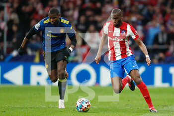 2022-02-23 - Geoffrey Kondogbia of Atletico de Madrid and Paul Pogba of Manchester United during the UEFA Champions League, round of 16, 1st leg football match between Atletico de Madrid and Manchester United on February 23, 2022 in Madrid, Spain - ATLETICO DE MADRID VS MANCHESTER UNITED - UEFA CHAMPIONS LEAGUE - SOCCER