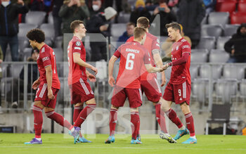 2022-03-08 - Robert Lewandowski of Bayern Munich celebrates with Benjamin Pavard and Joshua Kimmich during the UEFA Champions League, Round of 16, 2nd leg football match between Bayern Munich and Red Bull Salzburg on March 8, 2022 at Allianz Arena in Munich, Germany - BAYERN MUNICH VS RED BULL SALZBURG - UEFA CHAMPIONS LEAGUE - SOCCER
