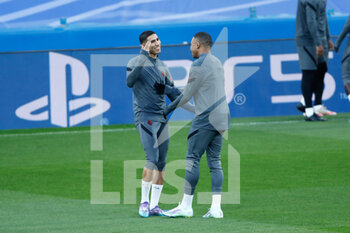 2022-03-08 - Achraf Hakimi and Kylian Mbappe during the training session of Paris Saint-Germain prior to the UEFA Champions League, round of 16, second leg football match against Real Madrid on March 8, 2022 at Santiago Bernabeu stadium in Madrid, Spain - TRAINING SESSION OF PARIS SAINT-GERMAIN PRIOR TO THE UEFA CHAMPIONS LEAGUE AGAINST REAL MADRID - UEFA CHAMPIONS LEAGUE - SOCCER