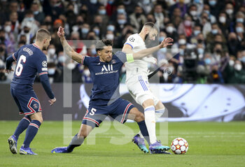 2022-03-09 - Marquinhos of PSG, Karim Benzema of Real Madrid during the UEFA Champions League, Round of 16, 2nd leg football match between Real Madrid and Paris Saint-Germain (PSG) on March 9, 2022 at Santiago Bernabeu stadium in Madrid, Spain - REAL MADRID VS PARIS SAINT-GERMAIN - UEFA CHAMPIONS LEAGUE - SOCCER