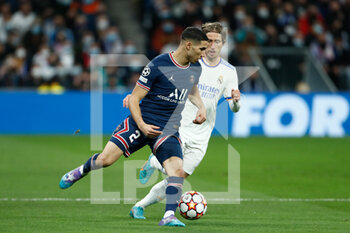 2022-03-09 - Achraf Hakimi of PSG and Luka Modric of Real Madrid during the UEFA Champions League, Round of 16, 2nd leg football match between Real Madrid and Paris Saint-Germain on March 9, 2022 at Santiago Bernabeu stadium in Madrid, Spain - REAL MADRID VS PARIS SAINT-GERMAIN - UEFA CHAMPIONS LEAGUE - SOCCER