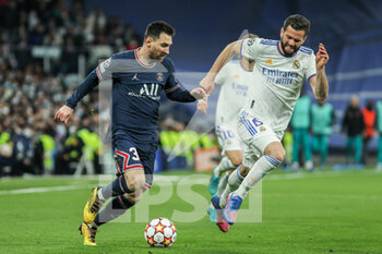2022-03-09 - Lionel Messi of PSG and Nacho Fernandez of Real Madrid during the UEFA Champions League, Round of 16, 2nd leg football match between Real Madrid and Paris Saint-Germain on March 9, 2022 at Santiago Bernabeu stadium in Madrid, Spain - REAL MADRID VS PARIS SAINT-GERMAIN - UEFA CHAMPIONS LEAGUE - SOCCER
