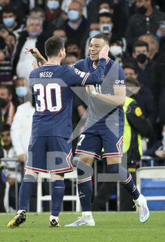 2022-03-09 - Kylian Mbappe of PSG celebrates his goal with Lionel Messi (left) during the UEFA Champions League, Round of 16, 2nd leg football match between Real Madrid and Paris Saint-Germain (PSG) on March 9, 2022 at Santiago Bernabeu stadium in Madrid, Spain - REAL MADRID VS PARIS SAINT-GERMAIN - UEFA CHAMPIONS LEAGUE - SOCCER
