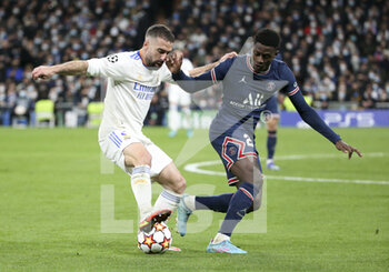 2022-03-09 - Daniel Carvajal of Real Madrid, Nuno Mendes of PSG during the UEFA Champions League, Round of 16, 2nd leg football match between Real Madrid and Paris Saint-Germain (PSG) on March 9, 2022 at Santiago Bernabeu stadium in Madrid, Spain - REAL MADRID VS PARIS SAINT-GERMAIN - UEFA CHAMPIONS LEAGUE - SOCCER
