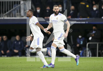 2022-03-09 - Karim Benzema of Real Madrid celebrates his first goal with David Alaba (left) during the UEFA Champions League, Round of 16, 2nd leg football match between Real Madrid and Paris Saint-Germain (PSG) on March 9, 2022 at Santiago Bernabeu stadium in Madrid, Spain - REAL MADRID VS PARIS SAINT-GERMAIN - UEFA CHAMPIONS LEAGUE - SOCCER