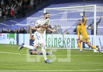2022-03-09 - Karim Benzema of Real Madrid celebrates his goal while goalkeeper of PSG Gianluigi Donnarumma looks on during the UEFA Champions League, Round of 16, 2nd leg football match between Real Madrid and Paris Saint-Germain (PSG) on March 9, 2022 at Santiago Bernabeu stadium in Madrid, Spain - REAL MADRID VS PARIS SAINT-GERMAIN - UEFA CHAMPIONS LEAGUE - SOCCER