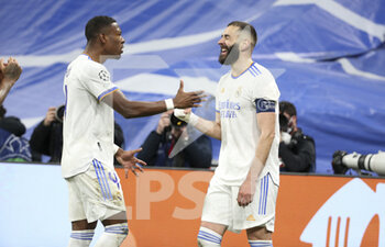 2022-03-09 - Karim Benzema of Real Madrid celebrates his goal with David Alaba (left) during the UEFA Champions League, Round of 16, 2nd leg football match between Real Madrid and Paris Saint-Germain (PSG) on March 9, 2022 at Santiago Bernabeu stadium in Madrid, Spain - REAL MADRID VS PARIS SAINT-GERMAIN - UEFA CHAMPIONS LEAGUE - SOCCER
