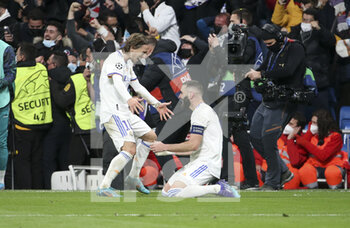 2022-03-09 - Karim Benzema of Real Madrid celebrates his goal with Luka Modric (left) during the UEFA Champions League, Round of 16, 2nd leg football match between Real Madrid and Paris Saint-Germain (PSG) on March 9, 2022 at Santiago Bernabeu stadium in Madrid, Spain - REAL MADRID VS PARIS SAINT-GERMAIN - UEFA CHAMPIONS LEAGUE - SOCCER