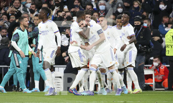 2022-03-09 - Karim Benzema of Real Madrid celebrates his third goal with teammates during the UEFA Champions League, Round of 16, 2nd leg football match between Real Madrid and Paris Saint-Germain (PSG) on March 9, 2022 at Santiago Bernabeu stadium in Madrid, Spain - REAL MADRID VS PARIS SAINT-GERMAIN - UEFA CHAMPIONS LEAGUE - SOCCER