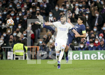 2022-03-09 - Karim Benzema of Real Madrid, Marquinhos of PSG during the UEFA Champions League, Round of 16, 2nd leg football match between Real Madrid and Paris Saint-Germain (PSG) on March 9, 2022 at Santiago Bernabeu stadium in Madrid, Spain - REAL MADRID VS PARIS SAINT-GERMAIN - UEFA CHAMPIONS LEAGUE - SOCCER