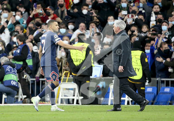 2022-03-09 - Kylian Mbappe of PSG salutes coach of Real Madrid Carlo Ancelotti following the UEFA Champions League, Round of 16, 2nd leg football match between Real Madrid and Paris Saint-Germain (PSG) on March 9, 2022 at Santiago Bernabeu stadium in Madrid, Spain - REAL MADRID VS PARIS SAINT-GERMAIN - UEFA CHAMPIONS LEAGUE - SOCCER