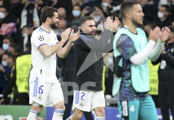 2022-03-09 - Nacho Fernandez, Daniel Carvajal of Real Madrid and teammates celebrate the victory following the UEFA Champions League, Round of 16, 2nd leg football match between Real Madrid and Paris Saint-Germain (PSG) on March 9, 2022 at Santiago Bernabeu stadium in Madrid, Spain - REAL MADRID VS PARIS SAINT-GERMAIN - UEFA CHAMPIONS LEAGUE - SOCCER