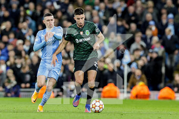 2022-03-09 - Goncalo Inacio (25) of Sporting CP tussles with Phil Foden (47) of Manchester City during the UEFA Champions League, Round of 16, 2nd leg football match between Manchester City and Sporting Lisbon on March 9, 2022 at the Etihad Stadium in Manchester, England - MANCHESTER CITY VS SPORTING LISBON - UEFA CHAMPIONS LEAGUE - SOCCER