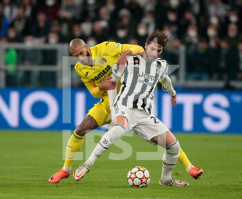 2022-03-16 - Manuel Locatelli of Juventus Fc and Etienne Capoue of Villareal Cf during the UEFA Champions League, Round of 16, 2nd leg football match between Juventus FC and Villarreal CF on March 16, 2022 at Allianz Stadium in Turin, Italy - JUVENTUS FC VS VILLAREAL FC - UEFA CHAMPIONS LEAGUE - SOCCER
