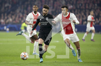 2022-03-15 - Rafa Silva of Benfica, Noussair Mazraoui of Ajax during the UEFA Champions League, Round of 16, 2nd leg football match between AFC AJAX Amsterdam and SL Benfica Lisbon on March 15, 2022 at Johan Cruijff ArenA in Amsterdam, Netherlands - AFC AJAX AMSTERDAM VS SL BENFICA LISBON - UEFA CHAMPIONS LEAGUE - SOCCER