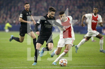 2022-03-15 - Rafa Silva of Benfica, Noussair Mazraoui of Ajax during the UEFA Champions League, Round of 16, 2nd leg football match between AFC AJAX Amsterdam and SL Benfica Lisbon on March 15, 2022 at Johan Cruijff ArenA in Amsterdam, Netherlands - AFC AJAX AMSTERDAM VS SL BENFICA LISBON - UEFA CHAMPIONS LEAGUE - SOCCER