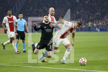 2022-03-15 - Rafa Silva of Benfica, Lisandro Martinez of Ajax during the UEFA Champions League, Round of 16, 2nd leg football match between AFC AJAX Amsterdam and SL Benfica Lisbon on March 15, 2022 at Johan Cruijff ArenA in Amsterdam, Netherlands - AFC AJAX AMSTERDAM VS SL BENFICA LISBON - UEFA CHAMPIONS LEAGUE - SOCCER