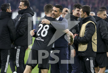 2022-03-15 - Coach of Benfica Nelson Verissimo and Julian Weigl (left) celebrate the victory and the qualification following the UEFA Champions League, Round of 16, 2nd leg football match between AFC AJAX Amsterdam and SL Benfica Lisbon on March 15, 2022 at Johan Cruijff ArenA in Amsterdam, Netherlands - AFC AJAX AMSTERDAM VS SL BENFICA LISBON - UEFA CHAMPIONS LEAGUE - SOCCER