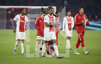2022-03-15 - Dejected, Sebastien Haller of Ajax and teammates salute the supporters following the UEFA Champions League, Round of 16, 2nd leg football match between AFC AJAX Amsterdam and SL Benfica Lisbon on March 15, 2022 at Johan Cruijff ArenA in Amsterdam, Netherlands - AFC AJAX AMSTERDAM VS SL BENFICA LISBON - UEFA CHAMPIONS LEAGUE - SOCCER