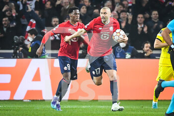 2022-03-16 - Burak YILMAZ of Lille celebrate his goal with Jonathan DAVID of Lille during the UEFA Champions League, Round of 16, 2nd leg football match between LOSC Lille and Chelsea on March 16, 2022 at Pierre Mauroy stadium in Villeneuve-d'Ascq, France - LOSC LILLE VS CHELSEA - UEFA CHAMPIONS LEAGUE - SOCCER