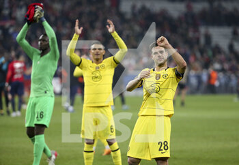 2022-03-16 - From right, Cesar Azpilicueta, Thiago Silva, goalkeeper of Chelsea Edouard Mendy celebrate the victory and the qualification following the UEFA Champions League, Round of 16, 2nd leg football match between Lille OSC (LOSC) and Chelsea on March 16, 2022 at Stade Pierre Mauroy in Villeneuve-d'Ascq near Lille, France - LOSC LILLE VS CHELSEA - UEFA CHAMPIONS LEAGUE - SOCCER