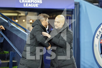 2022-04-05 - Pep Guardiola Manager of Manchester City greets Diego Simeone Manager of Atletico Madrid during the UEFA Champions League, Quarter-finals, 1st leg football match between Manchester City and Atletico Madrid on April 5, 2022 at the Etihad Stadium in Manchester, England - MANCHESTER CITY VS ATLETICO MADRID - UEFA CHAMPIONS LEAGUE - SOCCER