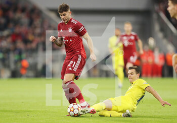 2022-04-12 - Lucas Hernandez of Bayern Munich and Giovani Lo Celso of Villarreal during the UEFA Champions League, Quarter-finals, 2nd leg football match between Bayern Munich and Villarreal CF on April 12, 2022 at Allianz Arena in Munich, Germany - BAYERN MUNICH VS VILLARREAL CF - UEFA CHAMPIONS LEAGUE - SOCCER