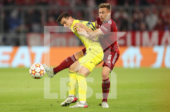 2022-04-12 - Giovani Lo Celso of Villarreal and Joshua Kimmich of Bayern Munich during the UEFA Champions League, Quarter-finals, 2nd leg football match between Bayern Munich and Villarreal CF on April 12, 2022 at Allianz Arena in Munich, Germany - BAYERN MUNICH VS VILLARREAL CF - UEFA CHAMPIONS LEAGUE - SOCCER