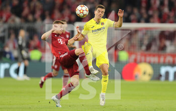 2022-04-12 - Joshua Kimmich of Bayern Munich and Giovani Lo Celso of Villarreal during the UEFA Champions League, Quarter-finals, 2nd leg football match between Bayern Munich and Villarreal CF on April 12, 2022 at Allianz Arena in Munich, Germany - BAYERN MUNICH VS VILLARREAL CF - UEFA CHAMPIONS LEAGUE - SOCCER