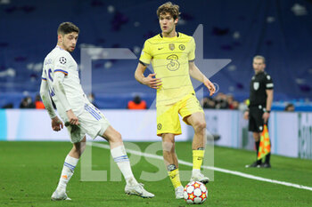 2022-04-12 - Fede Valverde of Real Madrid and Marcos Alonso of Chelsea during the UEFA Champions League, Quarter-finals, 2nd leg football match between Real Madrid and Chelsea on april 12, 2022 at Santiago Bernabeu stadium in Madrid, Spain - REAL MADRID VS CHELSEA - UEFA CHAMPIONS LEAGUE - SOCCER