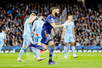 2022-04-26 - Karim Benzema (9) of Real Madrid celebrates his goal 2-1 during the UEFA Champions League, Semi-finals, 1st leg football match between Manchester City and Real Madrid on April 26, 2022 at the Etihad Stadium in Manchester, England - MANCHESTER CITY VS REAL MADRID - UEFA CHAMPIONS LEAGUE - SOCCER