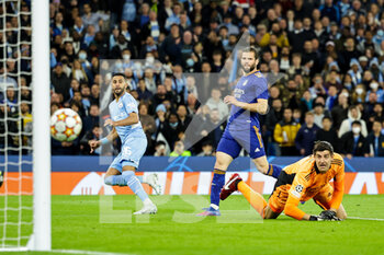2022-04-26 - Riyad Mahrez (26) of Manchester City hits the post, Nacho Fernandez and Thibaut Courtois of Real Madrid during the UEFA Champions League, Semi-finals, 1st leg football match between Manchester City and Real Madrid on April 26, 2022 at the Etihad Stadium in Manchester, England - MANCHESTER CITY VS REAL MADRID - UEFA CHAMPIONS LEAGUE - SOCCER