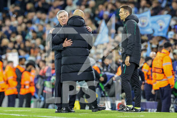 2022-04-26 - Pep Guardiola Manager of Manchester City hugs Carlo Ancelotti Manager of Real Madrid at full time during the UEFA Champions League, Semi-finals, 1st leg football match between Manchester City and Real Madrid on April 26, 2022 at the Etihad Stadium in Manchester, England - MANCHESTER CITY VS REAL MADRID - UEFA CHAMPIONS LEAGUE - SOCCER