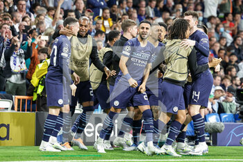 2022-05-04 - Riyad Mahrez (26) of Manchester City celebrates his goal 0-1 with teammates during the UEFA Champions League, Semi-finals, 2nd leg football match between Real Madrid and Manchester City on May 4, 2022 at the Santiago Bernabeu Stadium in Madrid, Spain - REAL MADRID VS MANCHESTER CITY - UEFA CHAMPIONS LEAGUE - SOCCER