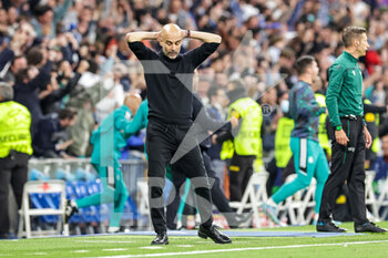 2022-05-04 - Pep Guardiola Head Coach of Manchester City reacts to the second Real Madrid goal during the UEFA Champions League, Semi-finals, 2nd leg football match between Real Madrid and Manchester City on May 4, 2022 at the Santiago Bernabeu Stadium in Madrid, Spain - REAL MADRID VS MANCHESTER CITY - UEFA CHAMPIONS LEAGUE - SOCCER