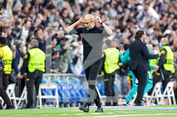 2022-05-04 - Pep Guardiola Head Coach of Manchester City reacts to the second goal of Real Madrid during the UEFA Champions League, Semi-finals, 2nd leg football match between Real Madrid and Manchester City on May 4, 2022 at the Santiago Bernabeu Stadium in Madrid, Spain - REAL MADRID VS MANCHESTER CITY - UEFA CHAMPIONS LEAGUE - SOCCER