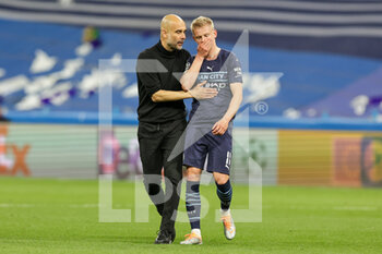 2022-05-04 - Pep Guardiola Head Coach of Manchester City with Oleksandr Zinchenko (11) of Manchester City at full time during the UEFA Champions League, Semi-finals, 2nd leg football match between Real Madrid and Manchester City on May 4, 2022 at the Santiago Bernabeu Stadium in Madrid, Spain - REAL MADRID VS MANCHESTER CITY - UEFA CHAMPIONS LEAGUE - SOCCER