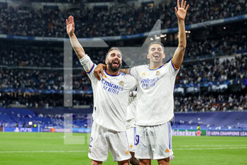 2022-05-04 - Daniel Carvajal (2) and Dani Ceballos (19) of Real Madrid celebrates at full time during the UEFA Champions League, Semi-finals, 2nd leg football match between Real Madrid and Manchester City on May 4, 2022 at the Santiago Bernabeu Stadium in Madrid, Spain - REAL MADRID VS MANCHESTER CITY - UEFA CHAMPIONS LEAGUE - SOCCER