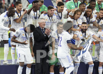 2022-05-28 - Marcelo Vieira da Silva of Real Madrid carries the cup during the trophy ceremony following the UEFA Champions League Final football match between Liverpool FC and Real Madrid CF on May 28, 2022 at Stade de France in Saint-Denis near Paris, France - FOOTBALL - CHAMPIONS LEAGUE - FINAL - LIVERPOOL V REAL MADRID - UEFA CHAMPIONS LEAGUE - SOCCER