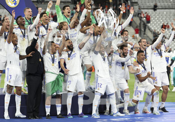 2022-05-28 - Marcelo Vieira da Silva of Real Madrid holding the cup and teammates celebrate during the trophy ceremony following the UEFA Champions League Final football match between Liverpool FC and Real Madrid CF on May 28, 2022 at Stade de France in Saint-Denis near Paris, France - FOOTBALL - CHAMPIONS LEAGUE - FINAL - LIVERPOOL V REAL MADRID - UEFA CHAMPIONS LEAGUE - SOCCER