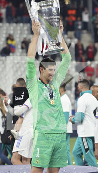 2022-05-28 - Goalkeeper of Real Madrid Thibaut Courtois celebrates during the trophy ceremony following the UEFA Champions League Final football match between Liverpool FC and Real Madrid CF on May 28, 2022 at Stade de France in Saint-Denis near Paris, France - FOOTBALL - CHAMPIONS LEAGUE - FINAL - LIVERPOOL V REAL MADRID - UEFA CHAMPIONS LEAGUE - SOCCER