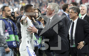 2022-05-28 - Coach of Real Madrid Carlo Ancelotti, David Alaba of Real Madrid (left) during the celebration following the UEFA Champions League Final football match between Liverpool FC and Real Madrid CF on May 28, 2022 at Stade de France in Saint-Denis near Paris, France - FOOTBALL - CHAMPIONS LEAGUE - FINAL - LIVERPOOL V REAL MADRID - UEFA CHAMPIONS LEAGUE - SOCCER