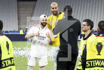 2022-05-28 - Karim Benzema of Real Madrid, French NBA champion Rudy Gobert during the celebration following the UEFA Champions League Final football match between Liverpool FC and Real Madrid CF on May 28, 2022 at Stade de France in Saint-Denis near Paris, France - FOOTBALL - CHAMPIONS LEAGUE - FINAL - LIVERPOOL V REAL MADRID - UEFA CHAMPIONS LEAGUE - SOCCER