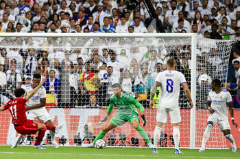 2022-05-28 - PARIS, FRANCE - MAY 28: Mohamed Salah of Liverpool (L) attempts a kick while being defended by Goalkeeper Thibaut Courtois of Real Madrid CF (R) during the UEFA Champions League final match between Liverpool FC and Real Madrid at Stade de France on May 28, 2022 in Paris, France. - LIVERPOOL FC V REAL MADRID - UEFA CHAMPIONS LEAGUE FINAL 2021/22 - UEFA CHAMPIONS LEAGUE - SOCCER