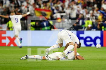 2022-05-28 - PARIS, FRANCE - MAY 28: Luka Modric of Real Madrid CF (L) celebrating with his teammate Carlos Casemiro of Real Madrid CF (B) after winning the UEFA Champions League final match between Liverpool FC and Real Madrid at Stade de France on May 28, 2022 in Paris, France. - LIVERPOOL FC V REAL MADRID - UEFA CHAMPIONS LEAGUE FINAL 2021/22 - UEFA CHAMPIONS LEAGUE - SOCCER