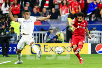 2022-05-28 - PARIS, FRANCE - MAY 28: Mohamed Salah of Liverpool (R) attempts a kick while being defended by Carlos Casemiro of Real Madrid CF (L) during the UEFA Champions League final match between Liverpool FC and Real Madrid at Stade de France on May 28, 2022 in Paris, France. - LIVERPOOL FC V REAL MADRID - UEFA CHAMPIONS LEAGUE FINAL 2021/22 - UEFA CHAMPIONS LEAGUE - SOCCER