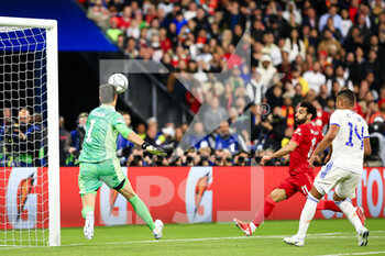 2022-05-28 - PARIS, FRANCE - MAY 28: Mohamed Salah of Liverpool (R) attempts a kick while being defended by Goalkeeper Thibaut Courtois of Real Madrid CF (L) during the UEFA Champions League final match between Liverpool FC and Real Madrid at Stade de France on May 28, 2022 in Paris, France. - LIVERPOOL FC V REAL MADRID - UEFA CHAMPIONS LEAGUE FINAL 2021/22 - UEFA CHAMPIONS LEAGUE - SOCCER