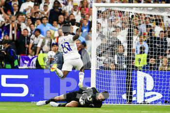 2022-05-28 - PARIS, FRANCE - MAY 28: Vinicius Junior of Real Madrid CF (L) attempts a kick while being defended by Alisson Becker of Liverpool (R) during the UEFA Champions League final match between Liverpool FC and Real Madrid at Stade de France on May 28, 2022 in Paris, France. - LIVERPOOL FC V REAL MADRID - UEFA CHAMPIONS LEAGUE FINAL 2021/22 - UEFA CHAMPIONS LEAGUE - SOCCER