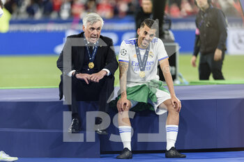 2022-05-28 - PARIS, FRANCE - MAY 28: Real Madrid Head Coach Carlo Ancelotti (L) and Daniel Ceballos of Real Madrid CF (C) celebrating after winning Liverpool during the UEFA Champions League final match between Liverpool FC and Real Madrid at Stade de France on May 28, 2022 in Paris, France. - LIVERPOOL FC V REAL MADRID - UEFA CHAMPIONS LEAGUE FINAL 2021/22 - UEFA CHAMPIONS LEAGUE - SOCCER